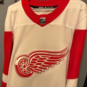 This is a like new Adidas Detroit Redwings Hockey jersey in size Adult Large.